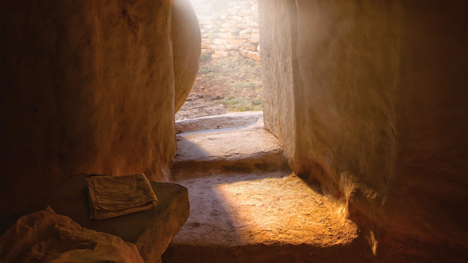 Light shines into the empty, open tomb of Jesus Christ.