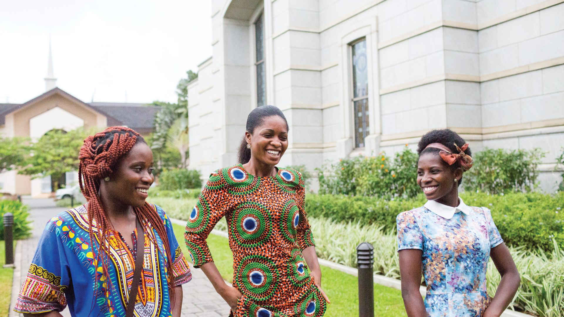 A photo of three African women walking on the grounds of the Ghana Accra Temple