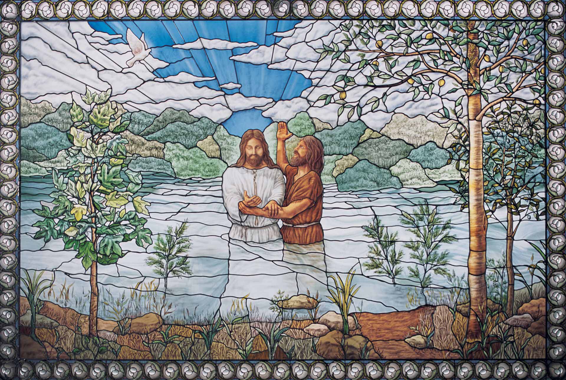 Stained-glass window in Nauvoo Illinois Temple, by Tom Holdman. Image via Church of Jesus Christ.