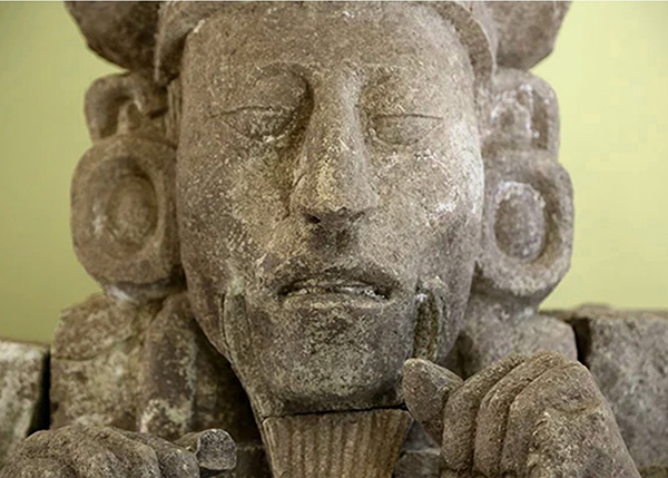 Sculptured head of a bearded Maya king from Copan, Honduras.
