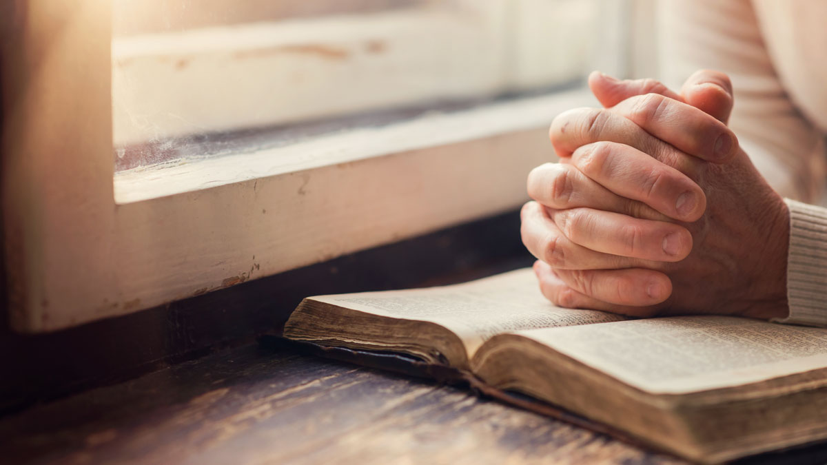 Woman with Bible by Halfpoint via Adobe Stock