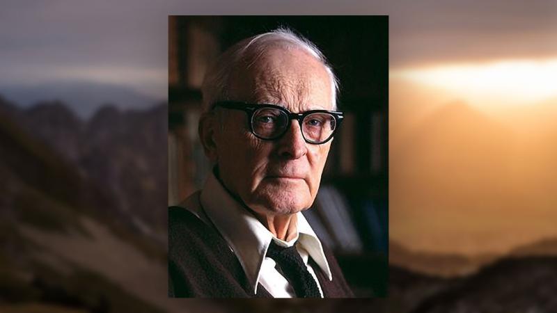 Portrait of Hugh Nibley with mountains.