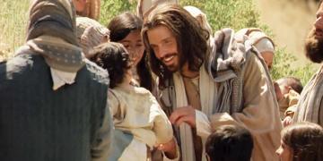A still from a Bible Video of Jesus Christ interacting with a child